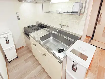 a small kitchen with a sink and a stove at Tokyo Stay West Sugamo #105 in Tokyo