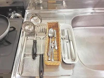 a kitchen sink with utensils in a sink at Tokyo Stay West Sugamo #105 in Tokyo