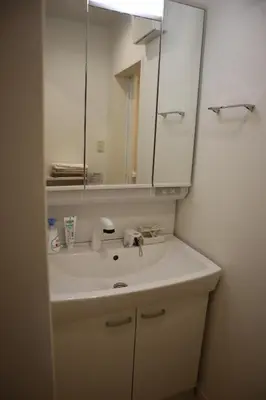 a bathroom with a sink and a mirror at Tateishi House101 in Tokyo