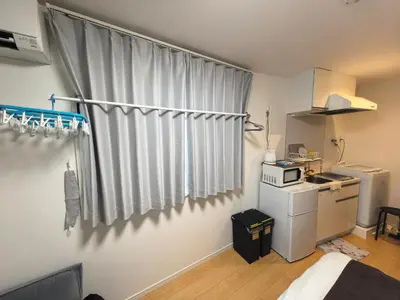 a small kitchen with a sink and a microwave at Tateishi House101 in Tokyo
