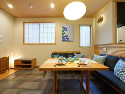 a living room with a table and a couch at Yadoya Asakusa Asagao in Tokyo