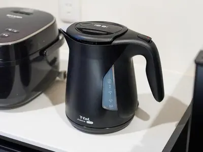 a black tea kettle on a counter next to a toaster at Yadoya Asakusa Asagao in Tokyo