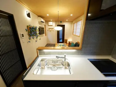 a kitchen with a sink and a mirror at Yadoya Asakusa Asagao in Tokyo