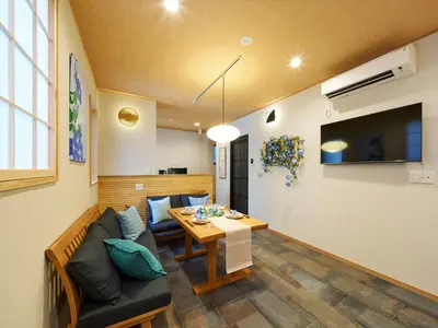 a living room with a couch and a table at Yadoya Asakusa Asagao in Tokyo