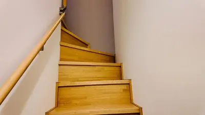 a staircase in a house with wooden steps at Tateishi House201 in Tokyo