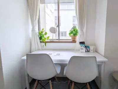 a white desk with two chairs and a window at Yoyogi 10min Walk Shinjuku&Shibuya 3bed in Tokyo