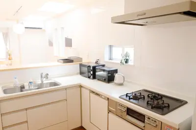a kitchen with a sink and a stove at Dori Dori House Shinjuku1 in Tokyo