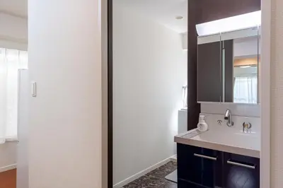 a bathroom with a sink and a mirror at \u30f4\u30a3\u30e9\u4ee3\u3005\u6728101 in Tokyo