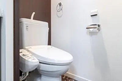 a bathroom with a white toilet in a stall at \u30f4\u30a3\u30e9\u4ee3\u3005\u6728101 in Tokyo