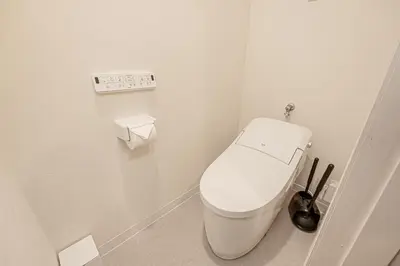 a bathroom with a white toilet in a room at Mi-HOTEL SUGAMO in Tokyo