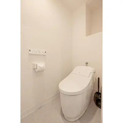 a bathroom with a white toilet in a room at Mi-HOTEL SUGAMO in Tokyo