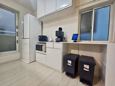a kitchen with a counter and two trash cans at Near Ikebukuro! 2min to Kita Ikebukuro Large House in Tokyo