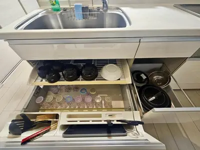 an open refrigerator next to a kitchen sink at Near Ikebukuro! 2min to Kita Ikebukuro Large House in Tokyo