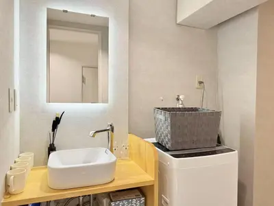 a bathroom with a sink and a mirror at NEW & Spacious home in Tokyo