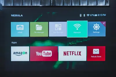 a computer screen with different logos on it at AT Shinjuku in Tokyo