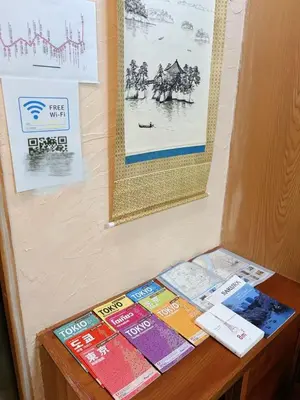 a bunch of books sitting on top of a table at Direct to Shinjuku 15 mins 3rooms Up to 9 Guests in Tokyo