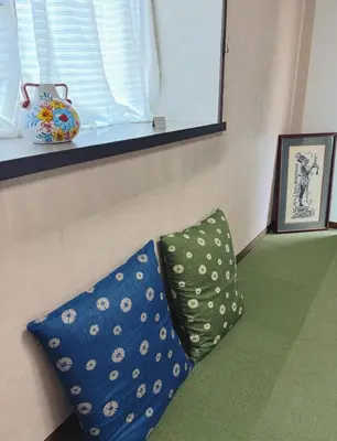 two pillows sitting on the floor next to a window at Direct to Shinjuku 15 mins 3rooms Up to 9 Guests in Tokyo