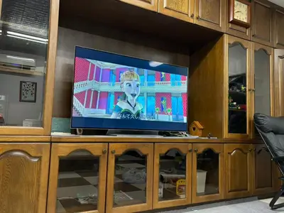 a flat screen tv sitting on top of a entertainment center at Direct to Shinjuku 15 mins 3rooms Up to 9 Guests in Tokyo