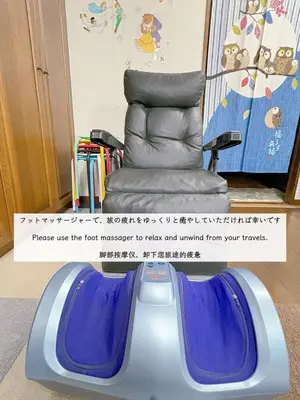 a blue and gray reclining chair in a room at Direct to Shinjuku 15 mins 3rooms Up to 9 Guests in Tokyo