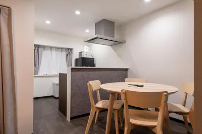 a kitchen and dining room with a table and chairs at Marble TOKYO Base Tabata 101 in Tokyo