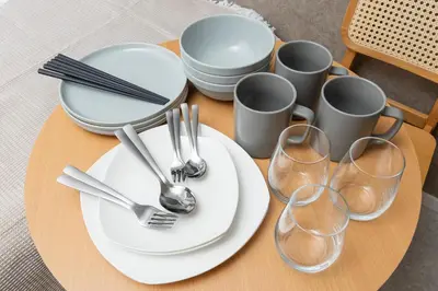 a table with plates and forks and wine glasses at 5 min to Shibuya, Easy Access to Hot Spots in Tokyo