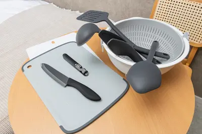 a cutting board with utensils on a table at 5 min to Shibuya, Easy Access to Hot Spots in Tokyo