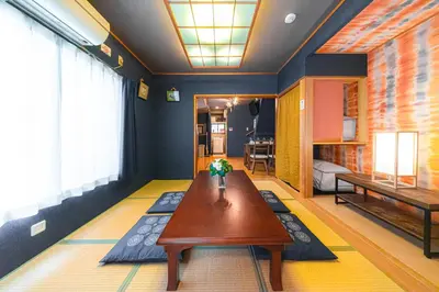 a living room with a table and a couch at HOTEL Kita-Shinagawa in Tokyo
