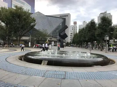 a fountain in a city with people walking around it at M102 8 mins from Ikebukuro sta9 min to Shinjuku by Train in Tokyo