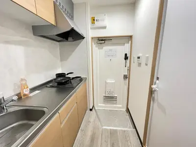 a small kitchen with a sink and a refrigerator at M102 8 mins from Ikebukuro sta9 min to Shinjuku by Train in Tokyo