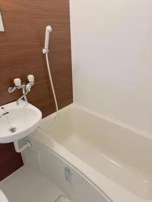 a white bathroom with a sink and a bath tub at M103 8 mins to Ikebukuro sta in Tokyo