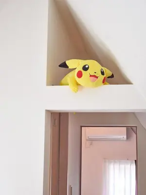 a stuffed pikachu toy sitting on top of a door at \u3068\u307e\u308a\u30fc\u3068Stay \u7acb\u4f1a\u5ddd Tomareat Stay Tachiaigawa in Tokyo