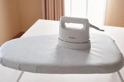 a white hair dryer sitting on top of a table at \u3068\u307e\u308a\u30fc\u3068Stay \u7acb\u4f1a\u5ddd Tomareat Stay Tachiaigawa in Tokyo
