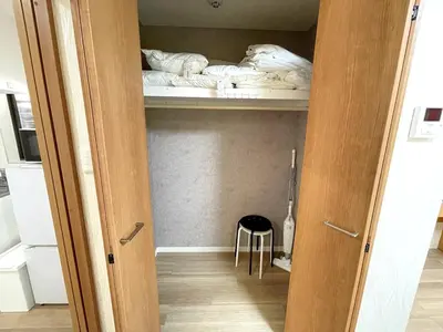 a room with a closet with a bed and a stool at M108 8 mins to Ikebukuro sta in Tokyo