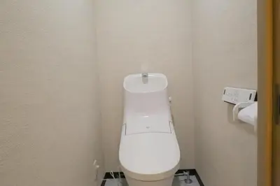 a bathroom with a white toilet in a stall at Maple & Ginkgo Views Autumn Stay Up To 9 N201 in Tokyo