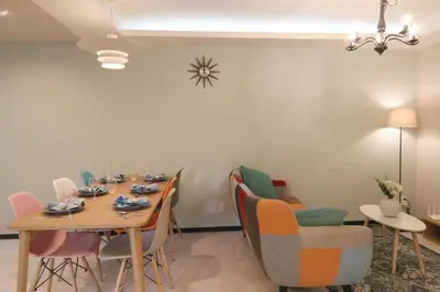 a dining room with a table and chairs at Maple & Ginkgo Views Autumn Stay Up To 9 N201 in Tokyo