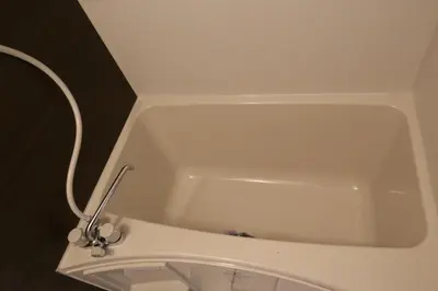 a white bath tub in a bathroom with a sink at Maple & Ginkgo Views Autumn Stay Up To 9 N201 in Tokyo