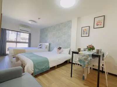 a hotel room with two beds and a table at M205 8 mins from Ikebukuro sta 9 min to Shinjuku by Train in Tokyo