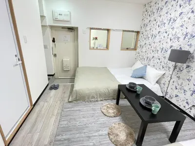 a small room with a bed and a table at Ikebukuro area6mins from staMax4 2 double beds \u5357\u9577\u5d0e101 in Tokyo
