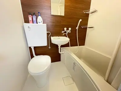 a small bathroom with a toilet and a sink at Ikebukuro area6mins from staMax4 2 double beds \u5357\u9577\u5d0e101 in Tokyo