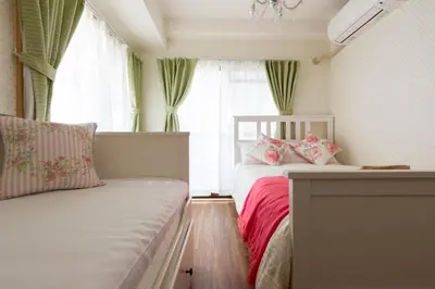 a small bedroom with a bed and a window at Ikebukuro area6mins from staMax6 2 bedrooms\u5357\u9577\u5d0e401 in Tokyo