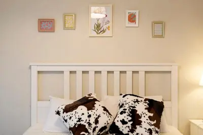 a bedroom with a bed with black and white pillows at Maple & Ginkgo ViewsAutumn Stay Near Ikebukuro N102 in Tokyo