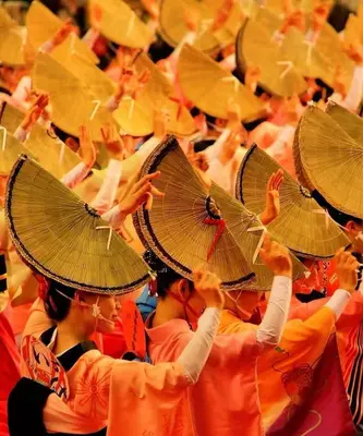 a group of people in orange uniforms holding umbrellas at Maple & Ginkgo ViewsAutumn Stay Near Ikebukuro N102 in Tokyo