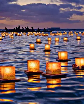 a group of candles floating on the water at night at Easy access to Ikebukuro Red Leaves ,Golden GinkgoM303 in Tokyo
