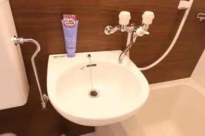 a white sink in a bathroom with a hair dryer at Maple & Ginkgo ViewsAutumn Stay Near Ikebukuro N105 in Tokyo