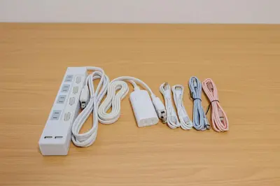 a nintendo wii game controller and pairs of flip flops at Cruise Inn Takenotsuka in Tokyo