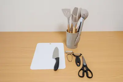a counter with a knife and scissors on a table at Cruise Inn Takenotsuka in Tokyo