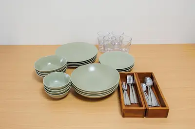a group of plates and utensils on a table at Cruise Inn Takenotsuka in Tokyo