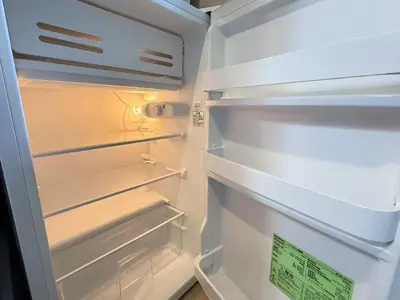 an empty refrigerator with its door open at \u6c60\u888b IVY House B C 2 in Tokyo