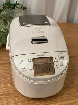 a toaster sitting on top of a wooden table at Tiare Home MOTOHASUNUMA in Tokyo