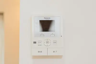 a white lightswitch on a white wall at K06 Quiet 2LDK house on JR Yamanote Line Komagome Station in Tokyo